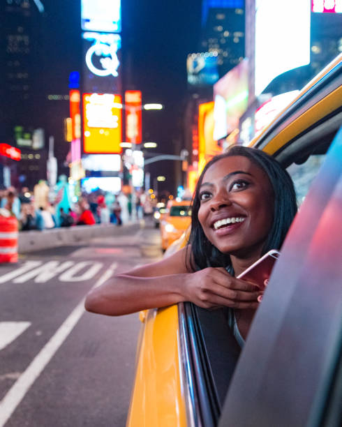 African Student Visiting New York in a Yellow Taxi